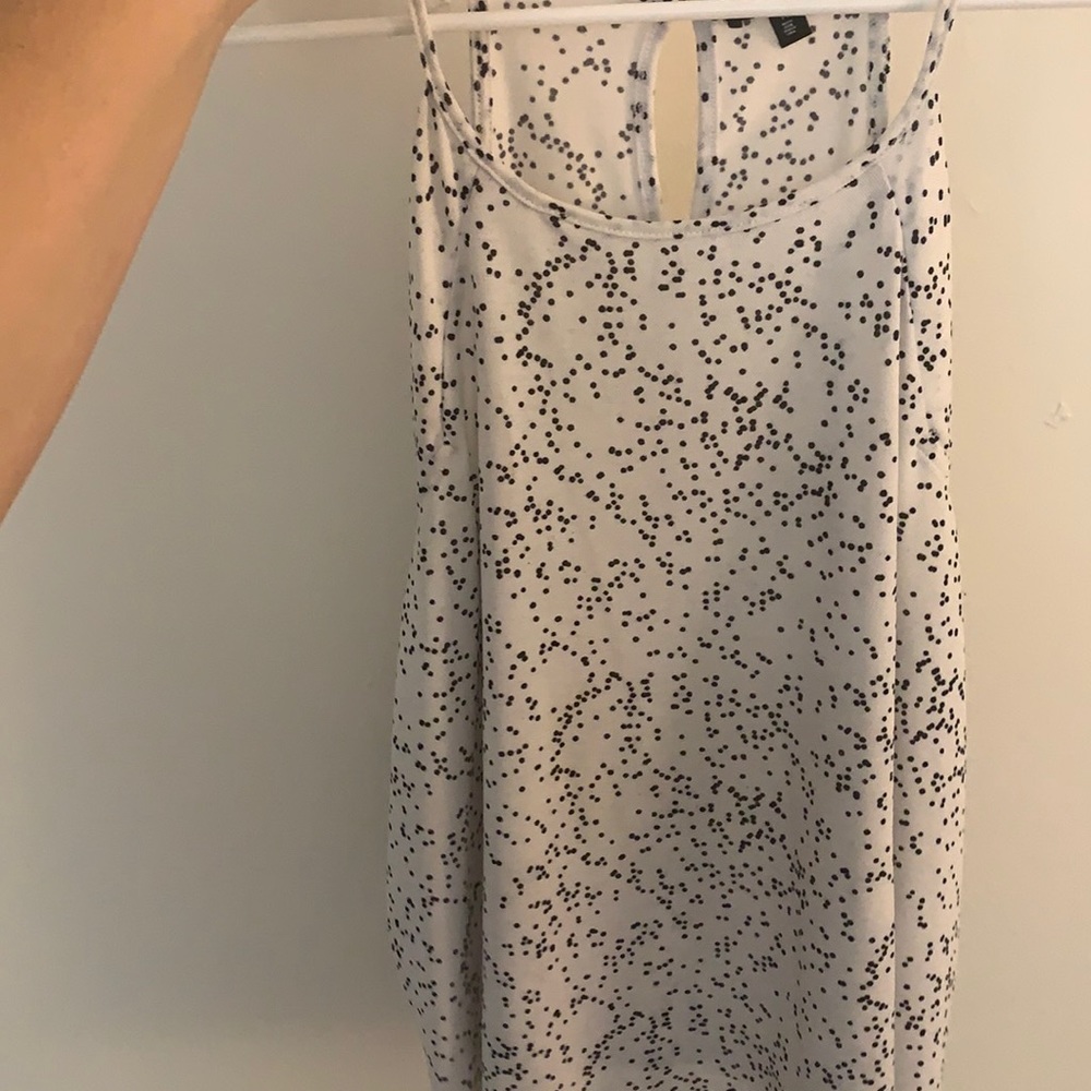 White with black dots, perfect condition.